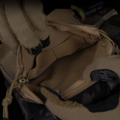 Close-up of Aegis Drop-In Utility Organization Pouch with retention loops secured to a chest rig, providing a reliable fit for dynamic movements during tactical operations.