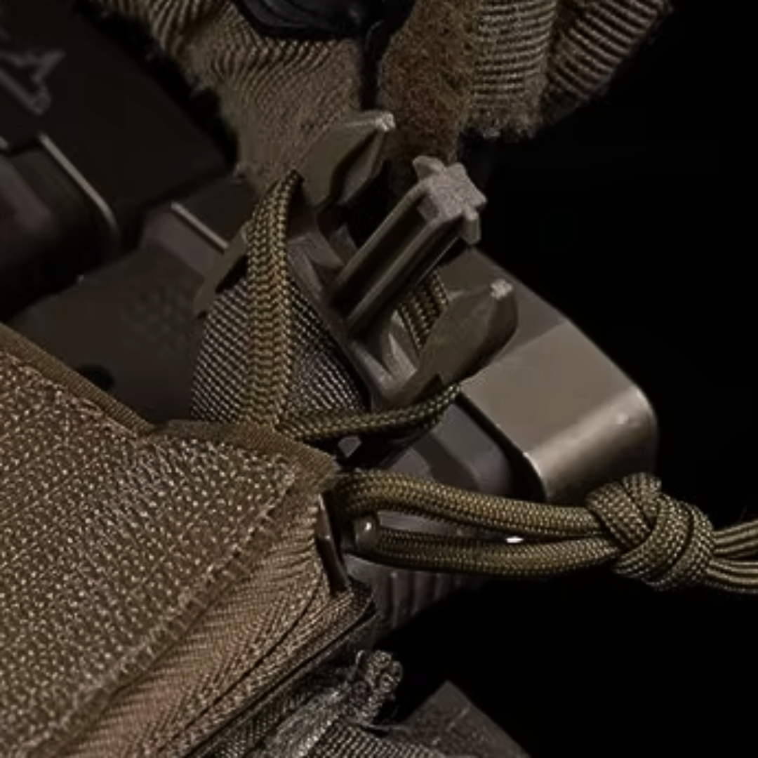 Aegis Drop-In Utility Organization Pouch filled with medical supplies, shotgun shells, and admin tools, highlighting its versatile storage capacity for mission-critical items on a chest rig or plate carrier.